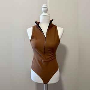Beautiful fairly new cognac brown turtle neck bodysuit with Zipper!